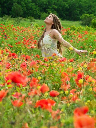 girl in field of flowers shutterstock